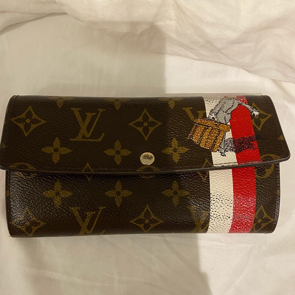 Limited Edition Louis Vuitton Wallet with red and white (EPI) stripe.